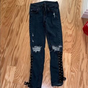 LF ripped jeans with ties on the bottom